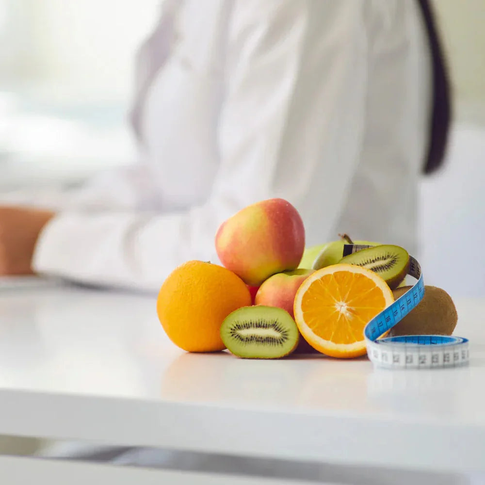 Fruit pile with a measuring tape on a blurred background